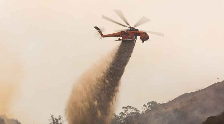 helicopter putting out the Woolsey fire